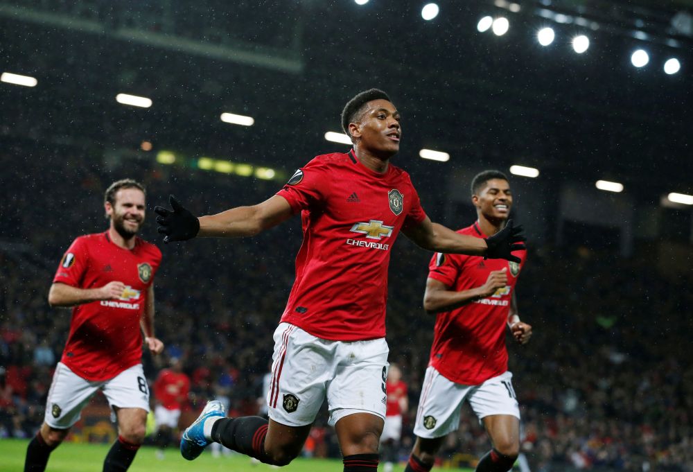Manchester United's Anthony Martial celebrates scoring their second goal against Partizan Belgrade. u00e2u20acu201d Reuters pic
