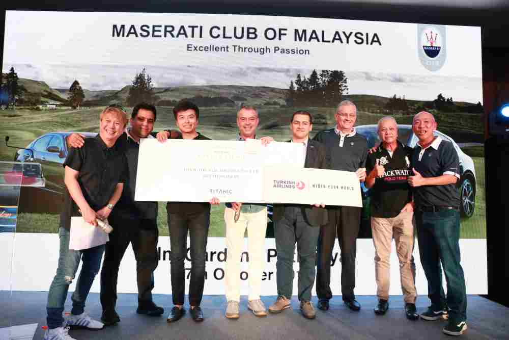 A generous golfer won the bid of a golf holiday package to Turkey in the charity auction. Sponsors, Matrix Holidays representative Ali Harkan (fourth left) and Turkish Airlines Malaysia director Muhammed Hamza Arslan (fifth left) gave away the prizes. ― Picture courtesy of Maserati Club of Malaysia