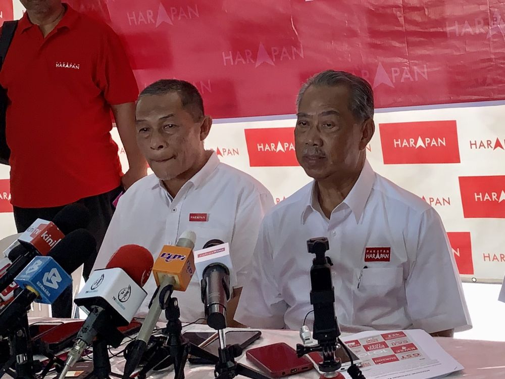 Tan Sri Muhyiddin Yassin (right) is pictured with Tanjung Piai candidate Karmaine Sardini in Rambah November 7, 2019. u00e2u20acu201d Picture by Ben Ta
