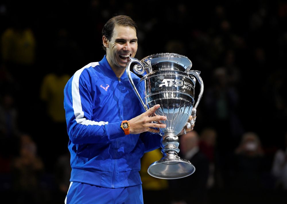 Spain's Rafael Nadal celebrates with the ATP World No.1 trophy after winning his group stage match against Greece's Stefanos Tsitsipas. u00e2u20acu201d Reuters pic