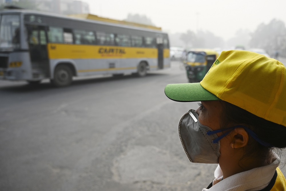A volunteer from civil defence monitors vehicles after the local government ordered half of the cityu00e2u20acu2122s cars to be taken off the road based on an odd-even registration plate system to help reduce air pollution, in New Delhi November 4, 2019. u00e2u20acu201d AFP pic