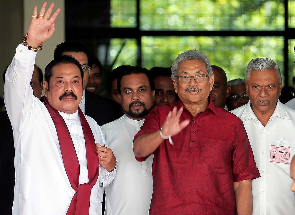 Gotabaya Rajapaksa (second right), with his brothers Mahinda (left) and Chamal (right), are seen as they leave the election commission in Colombo, Sri Lanka October 7, 2019. u00e2u20acu201d Reuters pic 