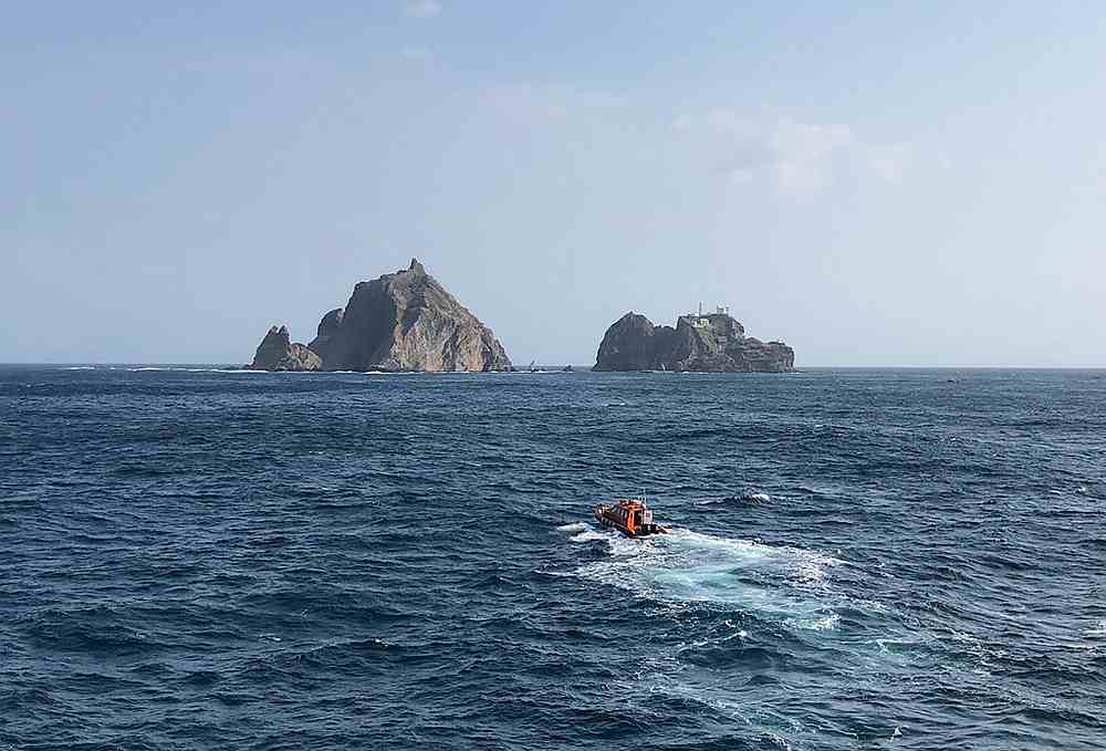 Rescue members searching for missing people after a helicopter crashed into the sea near the Dokdo islets, known as Takeshima in Japan, November 1, 2019. u00e2u20acu201d South Korea Coast Guard pic via AFP
