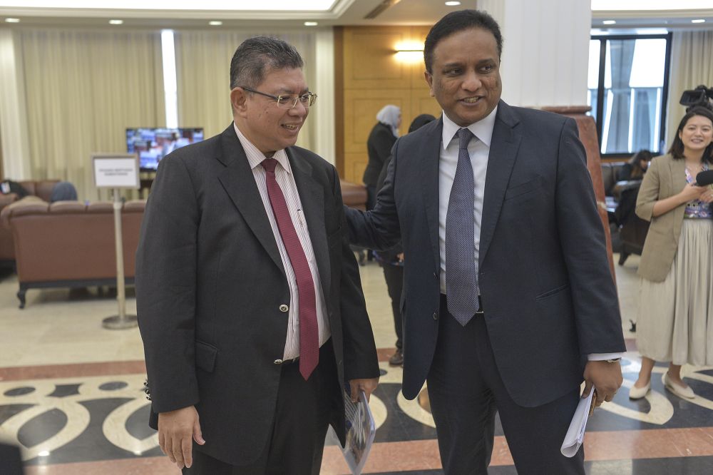 Foreign Affairs Datuk Saifuddin Abdullah shares a light moment with Kepala Batas MP Datuk Seri Reezal Merican (right) at Parliament November 7, 2019. u00e2u20acu201d Picture by Shafwan Zaidon