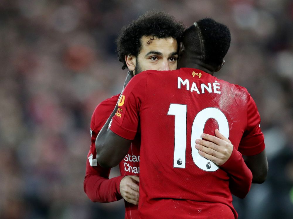 Liverpool's Mohamed Salah and Sadio Mane celebrate after Fabinhou00e2u20acu2122s strike against Manchester City. u00e2u20acu201d Reuters pic