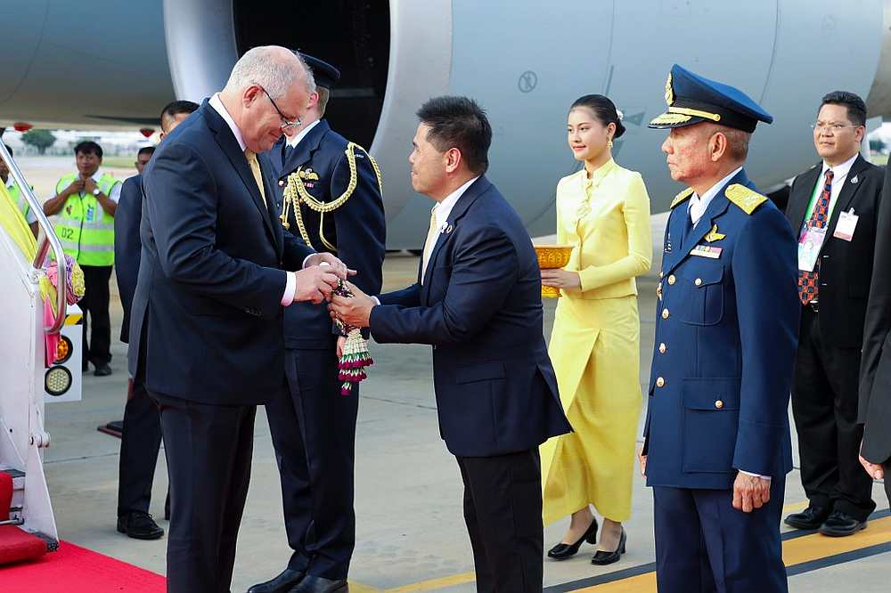 Australian Prime Minister Scott Morrison (left) is greeted by Thai Minister of Natural Resources and Environment Varawut Silpa-archa at Don Mueang International Airport, Bangkok November 3, 2019. u00e2u20acu201d Asean Summit Secretariat handout via AFP