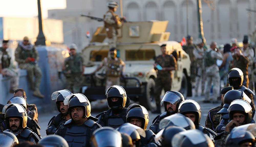 Riot police stand at Al Shuhada bridge during ongoing anti-government protests, in Baghdad Iraq November 5, 2019.  u00e2u20acu201d Reuters pic