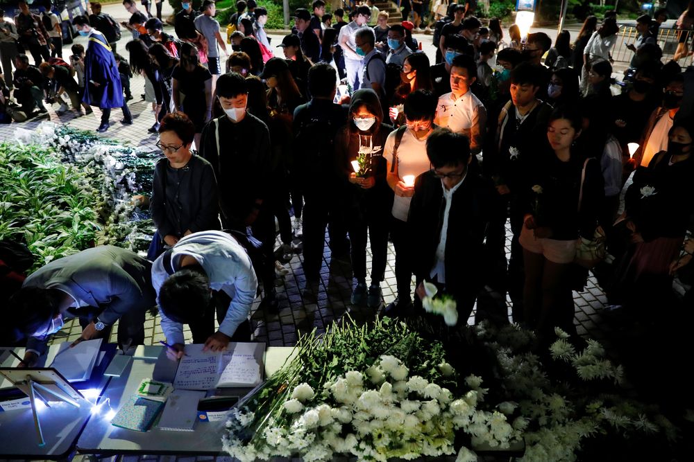 Students pay tribute with flowers to Chow Tsz-lok, 22, a university student who fell during protests at the weekend and died on Friday morning, at the Hong Kong University of Science and Technology, in Hong Kong, November 8, 2019. u00e2u20acu201d Reuters pic