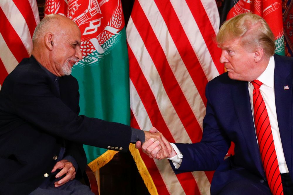 US President Donald Trump shakes hands with Afghanistan President Ashraf Ghani during a surprise visit at Bagram Air Base in Afghanistan November 28, 2019. u00e2u20acu201d Reuters pic