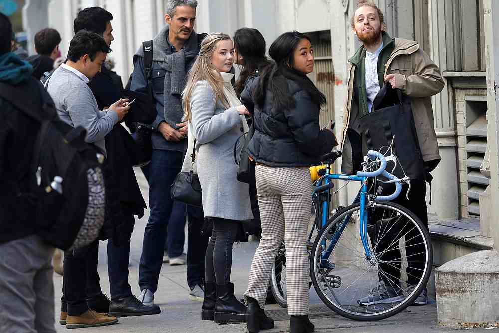 Laid-off WeWork employees gather on the sidewalk outside the entrance to the WeWork corporate headquarters in New York November 21, 2019. u00e2u20acu201d Reuters pic