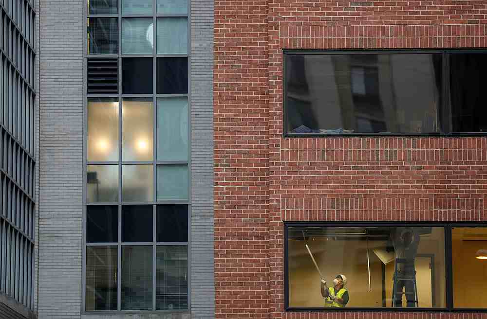 Workers are seen through the window of a building in Washington November 12, 2019. u00e2u20acu201d Reuters pic