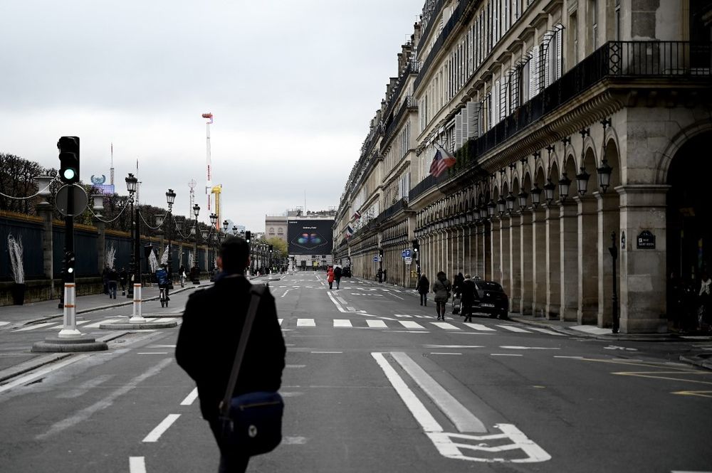 Persons walk on an empty Rivoli street as the accesses to the Concorde area and the Champs Elysees are blocked in Paris on November 16, 2019, on the first anniversary of the u00e2u20acu02dcyellow vestu00e2u20acu2122 (gilets jaunes) movement. u00e2u20acu201d AFP pic