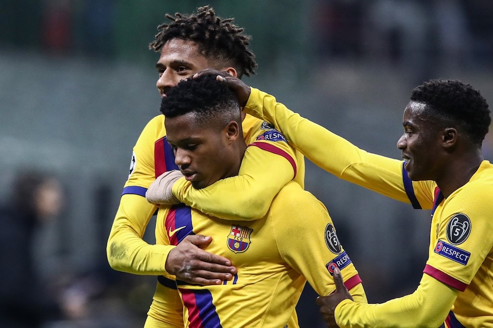Barcelonau00e2u20acu2122s Guinea-Bissau forward Ansu Fati celebrates with teamate Jean-Clair Todibo after scoring during the Uefa Champions League Group F match with Inter Milan at the San Siro in Milan December 10, 2019. u00e2u20acu201d AFP pic