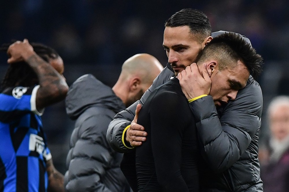 Inter Milanu00e2u20acu2122s Danilo Du00e2u20acu2122Ambrosio comforts teammate Lautaro Martinez at the end of the Uefa Champions League Group F match with Barcelona at the San Siro in Milan December 10, 2019. u00e2u20acu201d AFP pic
