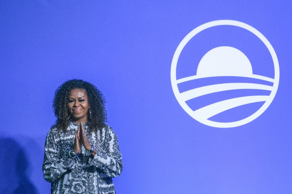 Former US first lady Michelle Obama gestures as she arrives to attend an event for the Obama Foundation in Kuala Lumpur December 12, 2019. u00e2u20acu201d AFP pic