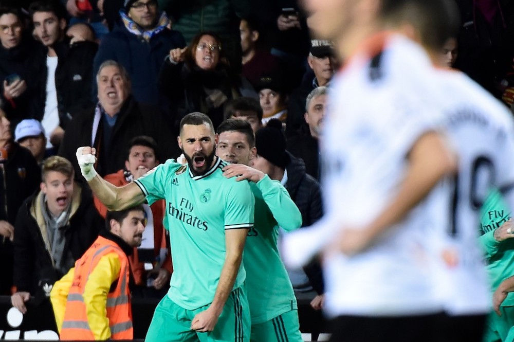 Real Madridu00e2u20acu2122s Karim Benzema celebrates after scoring a goal during the La Liga match with Valencia at the Mestalla stadium in Valencia December 15, 2019. u00e2u20acu201d AFP pic