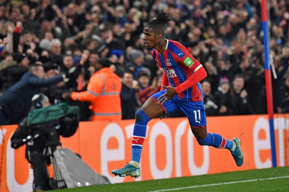 Crystal Palaceu00e2u20acu2122s Wilfried Zaha celebrates after scoring their first goal during the Premier League match with Brighton and Hove Albion at Selhurst Park in London December 16, 2019. u00e2u20acu201d AFP pic