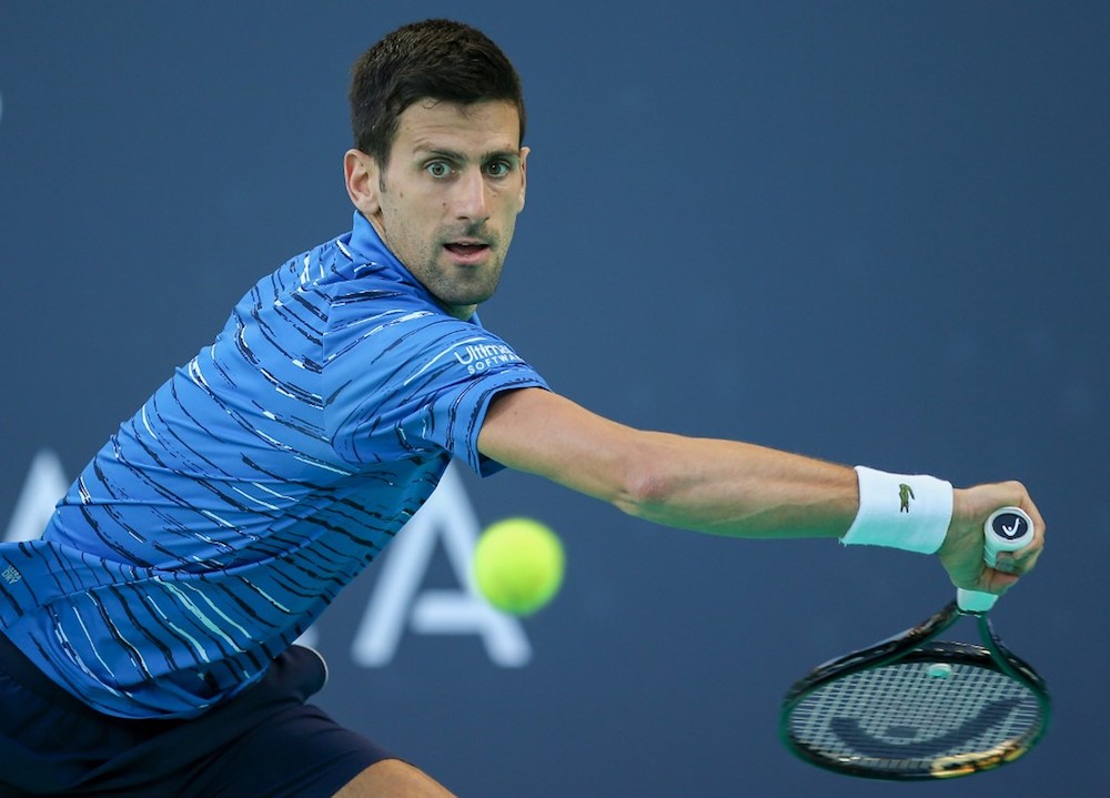 Serbiau00e2u20acu2122s Novak Djokovic returns the ball to Russiau00e2u20acu2122s Karen Khachanov during the Mubadala World Tennis Championship 3rd Place match at Zayed Sports City in Abu Dhabi December 21, 2019. u00e2u20acu201d AFP pic