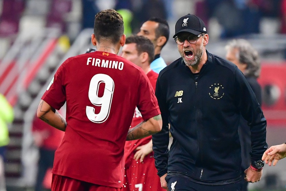 Liverpoolu00e2u20acu2122s Roberto Firmino celebrates his goal with manager Jurgen Klopp during the 2019 Fifa Club World Cup Final with Brazilu00e2u20acu2122s Flamengo at the Khalifa International Stadium in Doha December 21, 2019. u00e2u20acu201d AFP pic