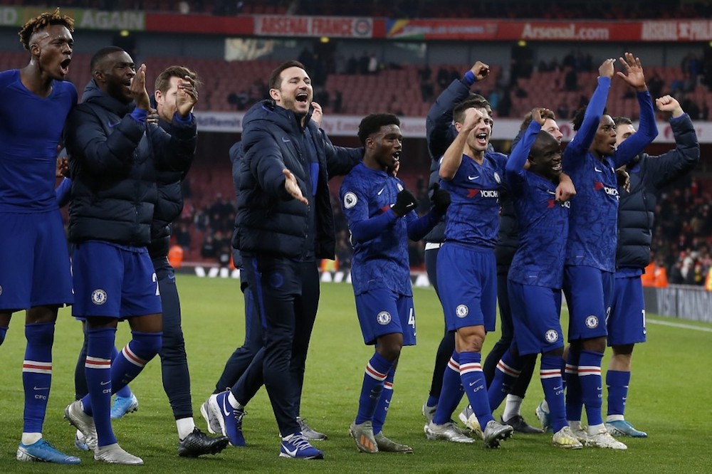 Chelsea manager Frank Lampard and the team salute the travelling fans as they celebrate their victory after their Premier League match with Arsenal at the Emirates Stadium in London December 29, 2019. u00e2u20acu201d AFP pic