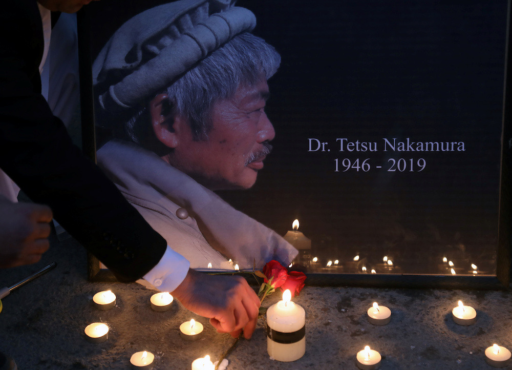 Afghan men light candles for Japanese doctor Tetsu Nakamura, who was killed in Jalalabad on December 4, 2019. u00e2u20acu201d Reuters pic