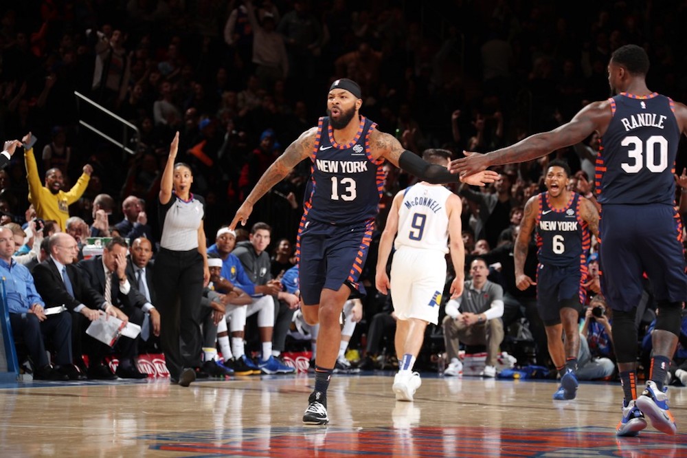 Marcus Morris Sr of the New York Knicks high fives teammate Julius Randle during a game against the Indiana Pacers at Madison Square Garden in New York December 7, 2019. u00e2u20acu201d AFP pic