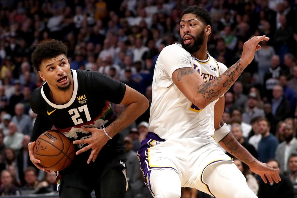 Jamal Murray of the Denver Nuggets drives against Anthony Davis of the Los Angeles Lakers in the fourth quarter at Pepsi Centre in Denver, Colorado December 3, 2019. — AFP pic