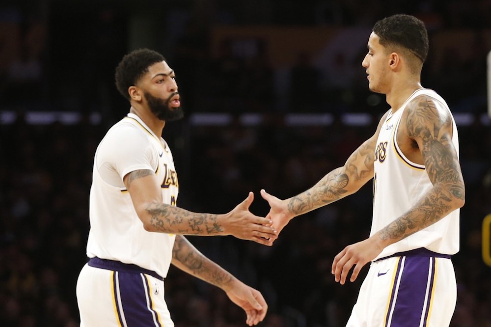 Kyle Kuzma and Anthony Davis of the Los Angeles Lakers high-five during the second half against the Minnesota Timberwolves at Staples Centre in Los Angeles December 8, 2019. u00e2u20acu201d AFP pic