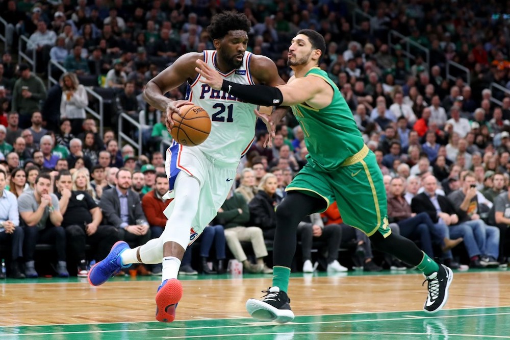 Enes Kanter of the Boston Celtics fouls Joel Embiid of the Philadelphia 76ers at TD Garden in Boston, Massachusetts December 12, 2019. u00e2u20acu201d AFP pic