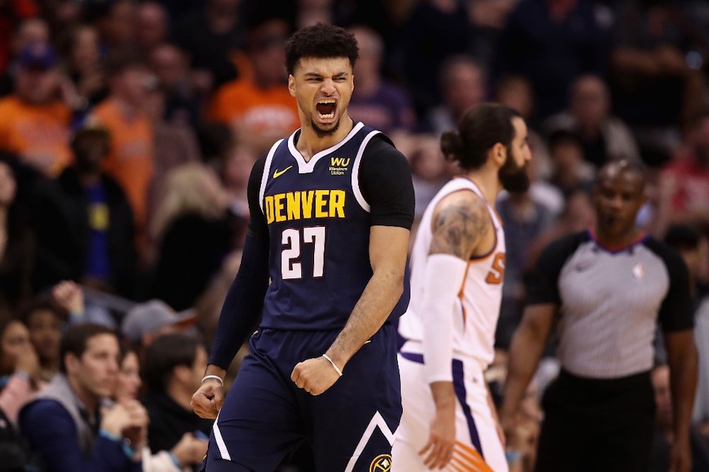 Jamal Murray of the Denver Nuggets celebrates after hitting a three-point shot over Ricky Rubio of the Phoenix Suns during the second half of the NBA game at Talking Stick Resort Arena in Phoenix, Arizona December 23, 2019. u00e2u20acu201d AFP pic