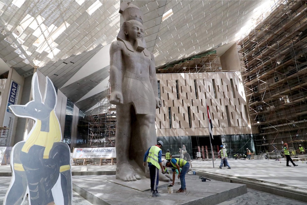 This picture shows the 3,200-year-old pink-granite colossal statue of King Ramses II at the entrance of the Grand Egyptian Museum under construction in Giza on the southwestern outskirts of the capital Cairo August 4, 2019. u00e2u20acu201d AFP pic