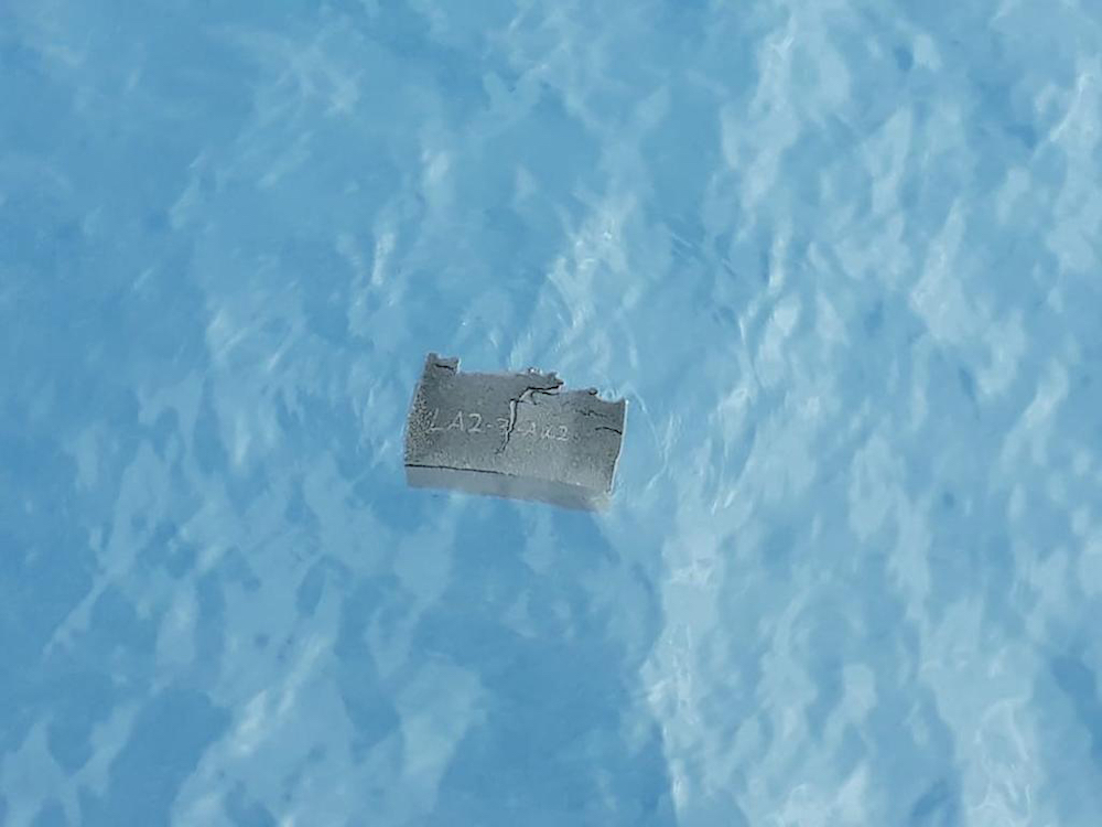 Handout picture released by the Chilean Air Force showing a part of a fuel tank, allegedly from the Chilean Air Force C-130 Hercules cargo plane found at Drake Passage, near to Chile December 11, 2019. u00e2u20acu201d AFP / Chilean Air Force pic