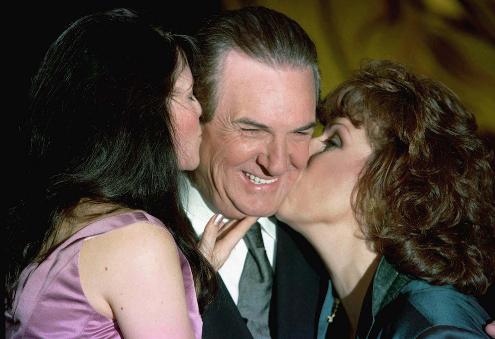 Actor Danny Aiello is kissed by actress Lucy Lawless (left) and actress Joy Behar at the New York Friars Club roast in his honour, September 26, 1997. u00e2u20acu201d Reuters file pic