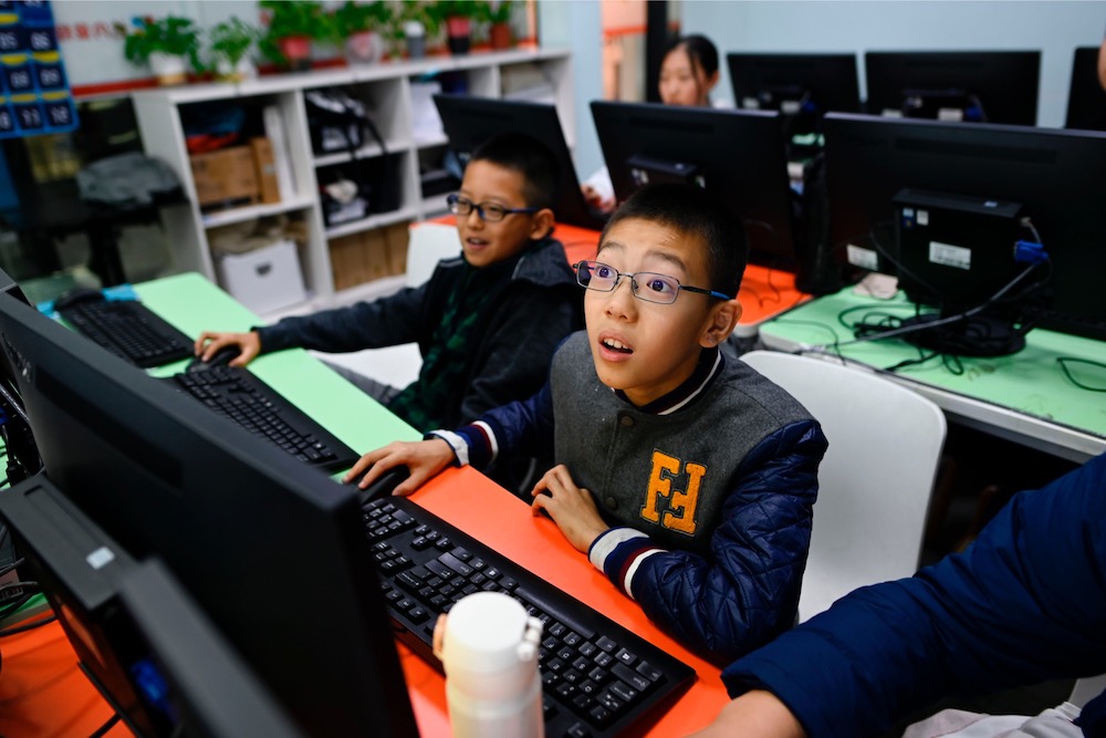 This picture taken on November 8, 2019 shows pupils attending a class at a children's computer coding training centre in Beijing. u00e2u20acu201d AFP pic