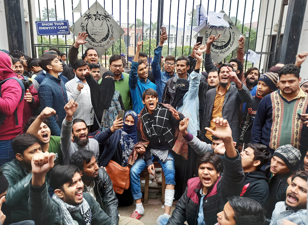 Demonstrators shout slogans during a protest outside a gate of the Jamia Millia Islamia university in New Delhi, India December 16, 2019. u00e2u20acu201d Reuters pic