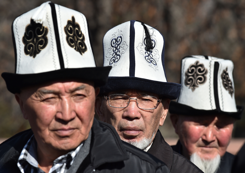 Kyrgyz men wearing traditional 'Ak-Kalpak' hats. u00e2u20acu201d AFP pic