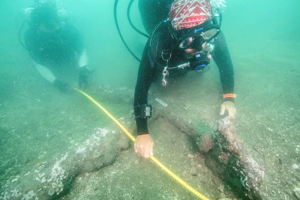 Marine archaeologists take measurements of a 16th century anchor that may represent ground tackle used during the scuttling of Hernan Cortes' fleet of 1519, December 16, 2019. u00e2u20acu201d National Institute of Anthropology and History handout via Reuters