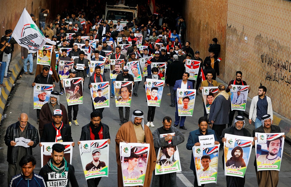 Iraqi demonstrators from Nassiriya city hold the pictures of people who were killed during ongoing anti-government protests in Baghdad December 6, 2019. u00e2u20acu201d Reuters pic