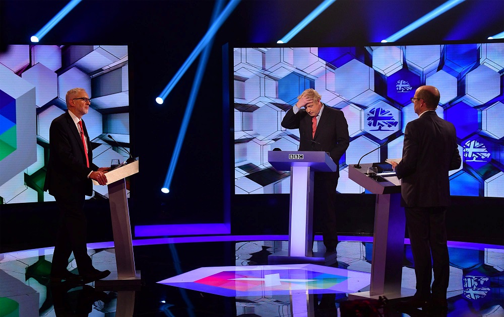 Britain's Prime Minister Boris Johnson and opposition Labour Party leader Jeremy Corbyn take part during a head-to-head debate on the BBC in London December 6, 2019. u00e2u20acu201d Picture by Jeff Overs/BBC/Handout via Reuters