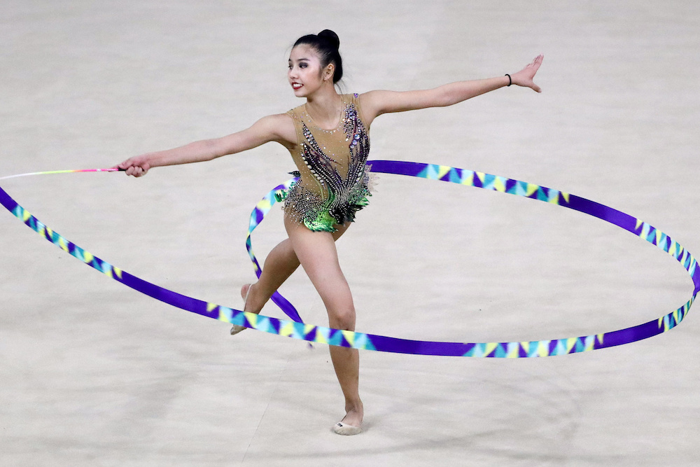 Malaysiau00e2u20acu2122s Koi Sie Yan in action during the ribbon final for Rhythmic Gymnastics at the 30th SEA Games in Manila December 7, 2019. u00e2u20acu201d Reuters pic