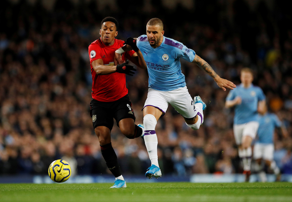 Manchester Cityu00e2u20acu2122s Kyle Walker in action with Manchester Unitedu00e2u20acu2122s Anthony Martial during their Premier League match at Etihad Stadium in Manchester December 7, 2019. u00e2u20acu201d Reuters pic