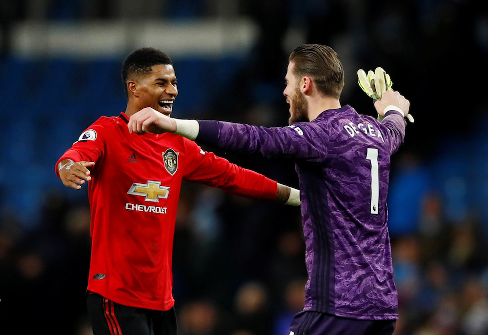Manchester United’s Marcus Rashford and David de Gea celebrate after the Premier League match with Manchester City at Etihad Stadium in Manchester December 7, 2019. — Action Images pic via Reuters