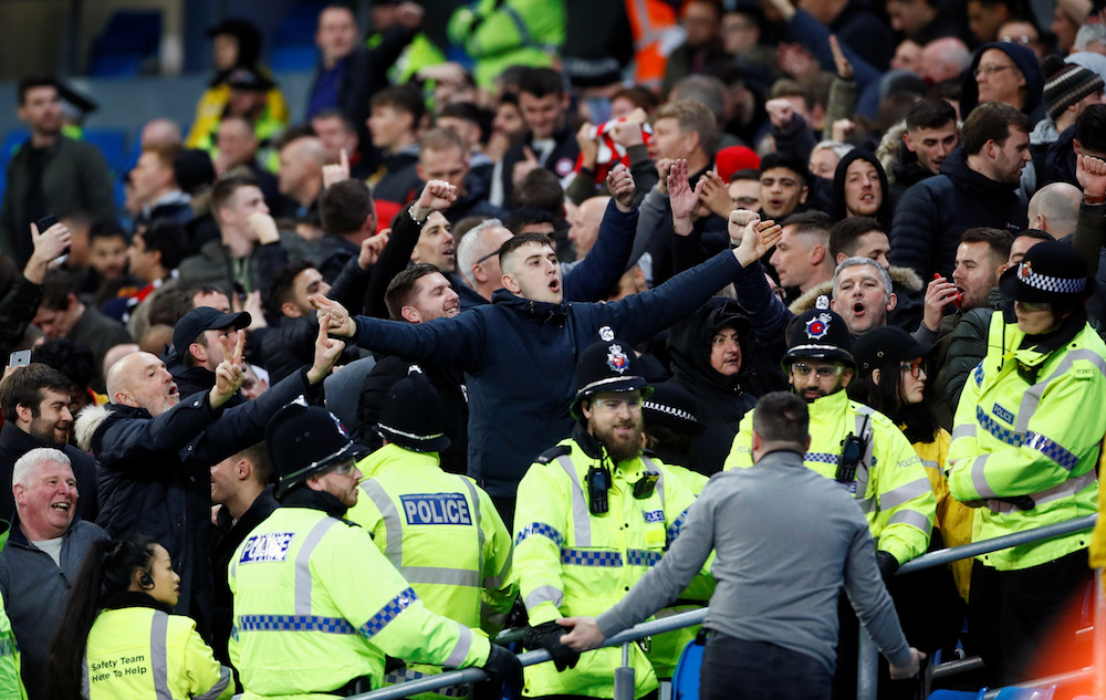 Fans and police clash after the Premier League match between Manchester City and Manchester United at Etihad Stadium in Manchester December 7, 2019. u00e2u20acu201d Action Images pic via Reuters