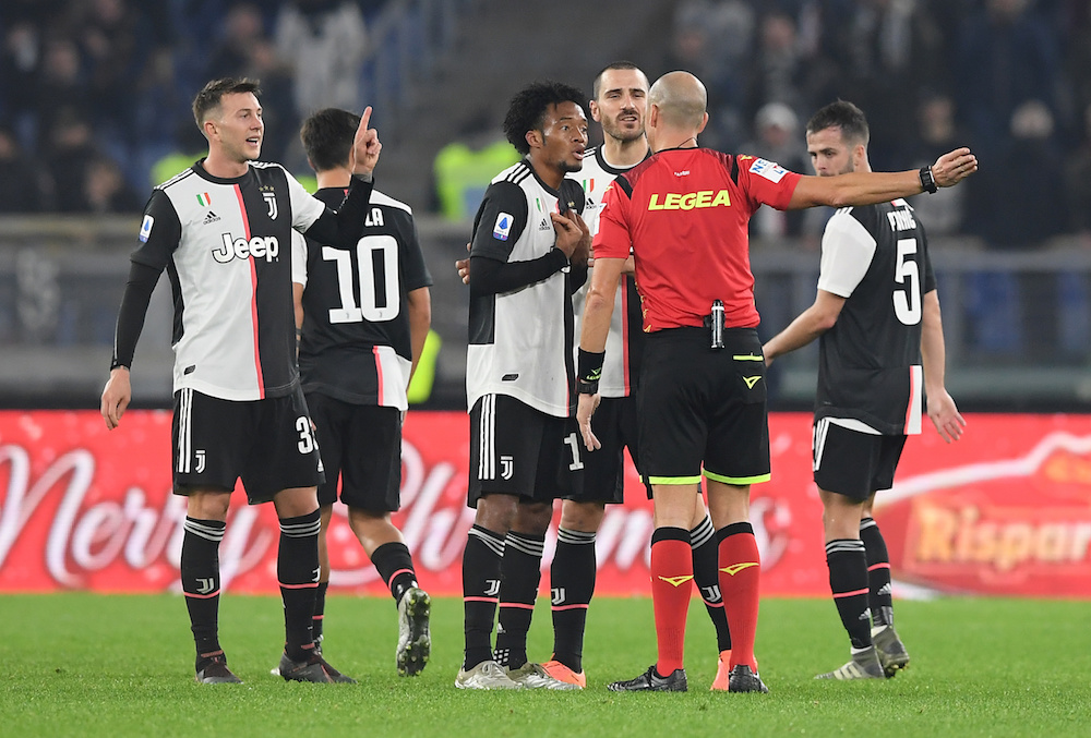 Juventus’ Juan Cuadrado and Leonardo Bonucci remonstrate with referee Michael Fabbri during the Serie A match with Lazio at Stadio Olimpico in Rome December 7, 2019. — Reuters pic
