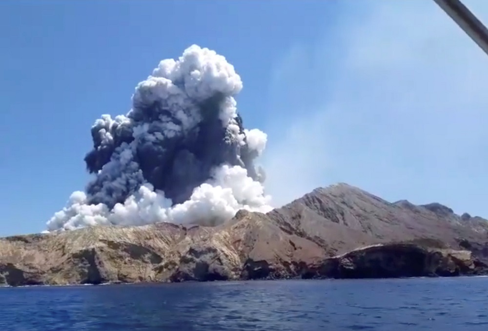 Smoke from the volcanic eruption of Whakaari, also known as White Island, is pictured from a boat, New Zealand December 9, 2019. u00e2u20acu201d Screen capture via Instagram/allessandrokauffmann/Reuters 