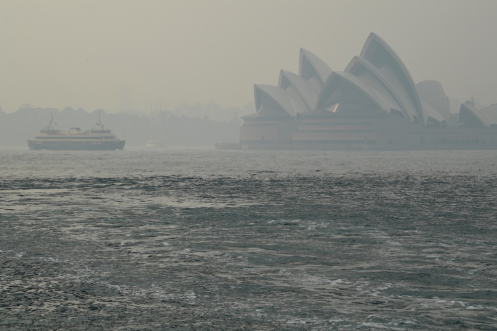 The Sydney Opera House can be seen as smoke haze from bushfires in New South Wales blankets the CBD in Sydney December 10, 2019. u00e2u20acu201d AAP Image/Joel Carrett via Reuters 