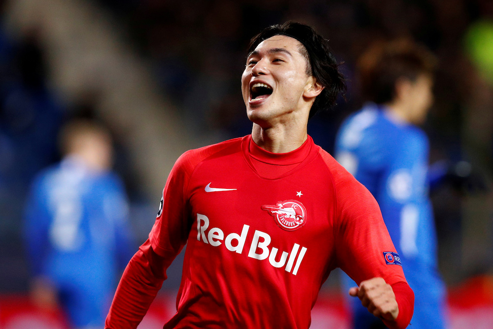 FC Salzburgu00e2u20acu2122s Takumi Minamino celebrates scoring their second goal during the Champions League Group E match with KRC Genk at Luminus Arena in Genk November 27, 2019. u00e2u20acu201d Reuters pic