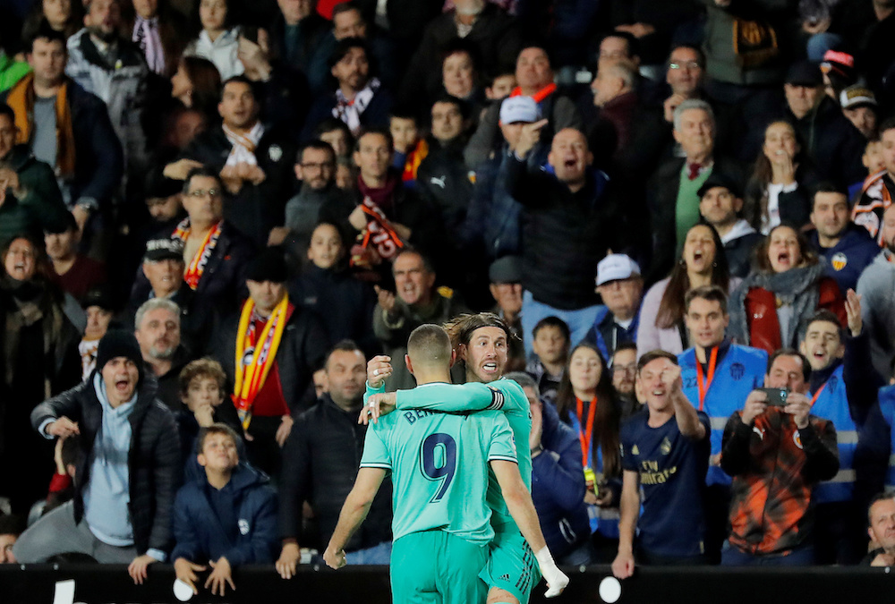 Real Madridu00e2u20acu2122s Karim Benzema celebrates scoring their first goal with Sergio Ramos during the La Liga match with Valencia at Mestalla in Valencia December 15, 2019. u00e2u20acu201d Reuters pic