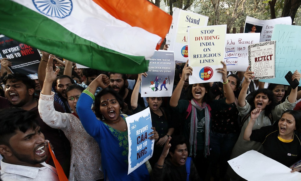 Students hold placards and shout slogans in solidarity with Jamia Millia Islamia university students after police entered the campus on Sunday in New Delhi, following a protest against a new citizenship law, in Mumbai December 16, 2019. — Reuters pic