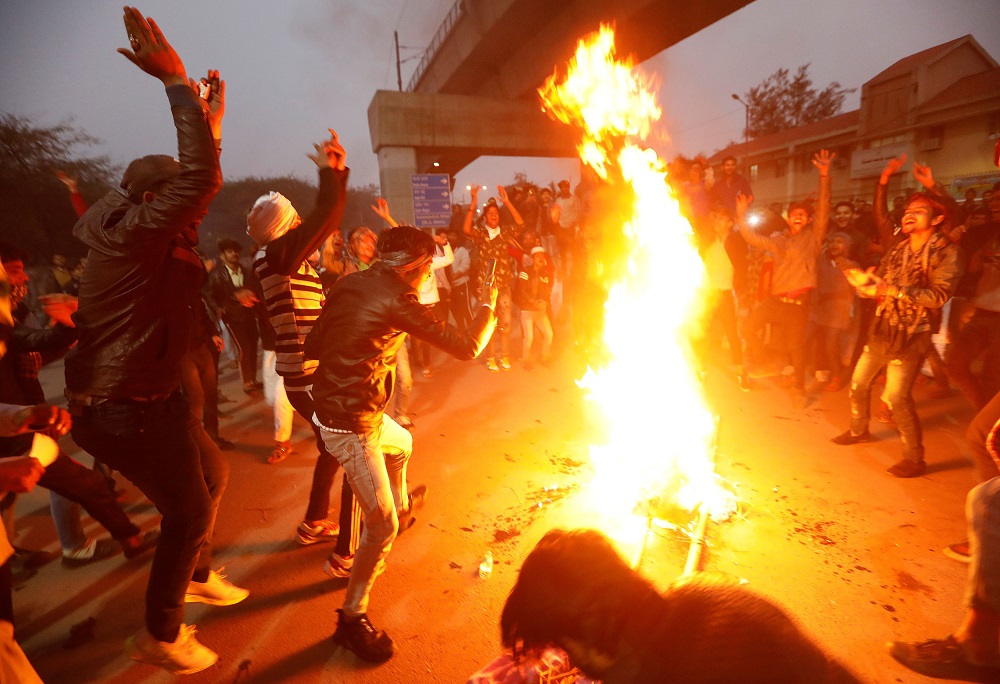 Demonstrators burn an effigy depicting Prime Minister Narendra Modi during a protest against a new citizenship law, outside Jamia Millia Islamia university in New Delhi December 16, 2019. u00e2u20acu201d Reuters pic